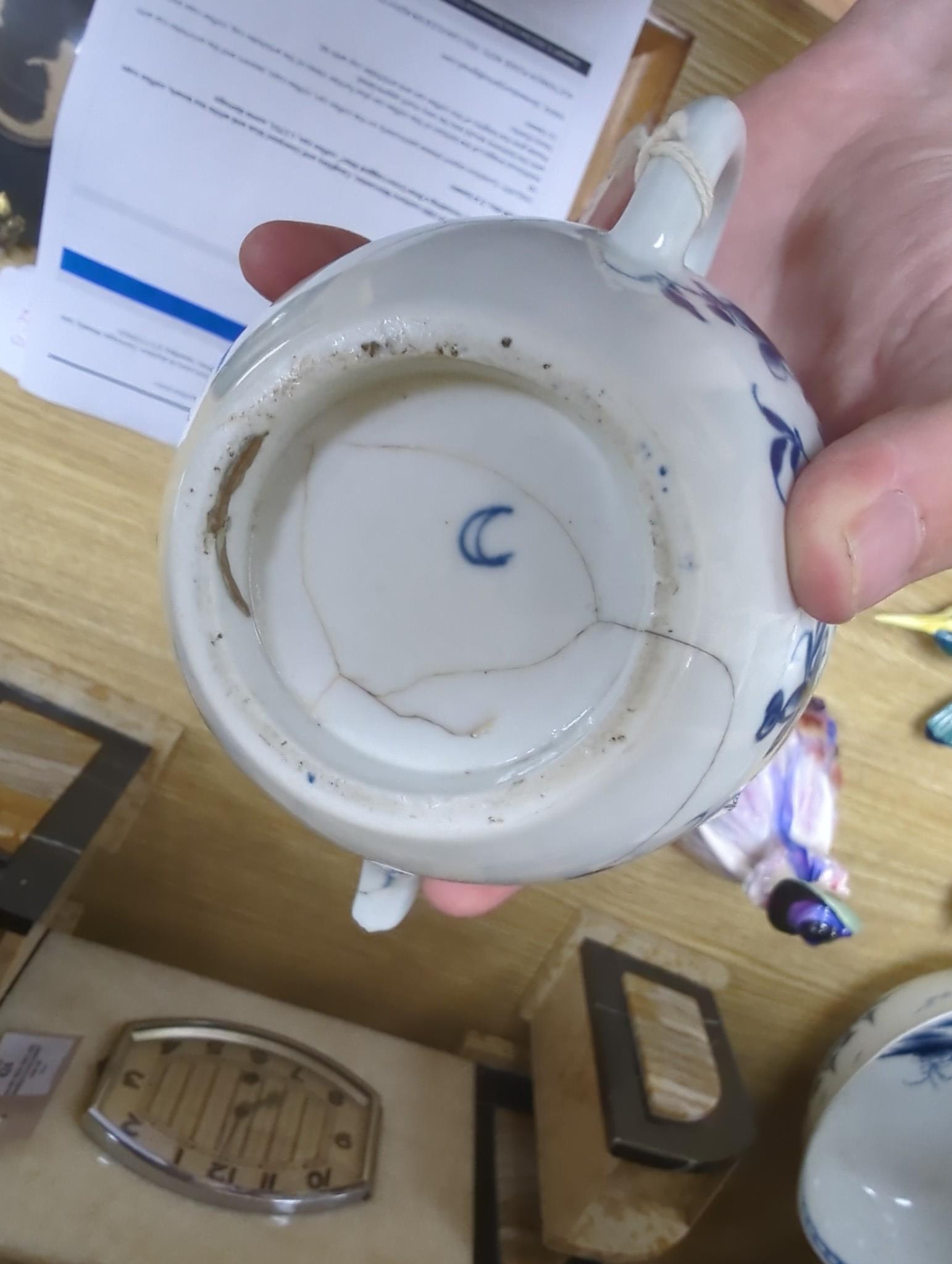 A large group of 18th century Worcester, Caughley and Liverpool blue and white tea bowls, coffee cups and saucers etc. including a Bow Cross-Legged Man